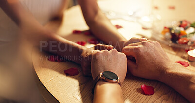 Buy stock photo Couple, holding hands and love on date at restaurant for valentines day, romantic dinner and celebration. People, closeup and affection of fine dining, anniversary bonding and relationship commitment