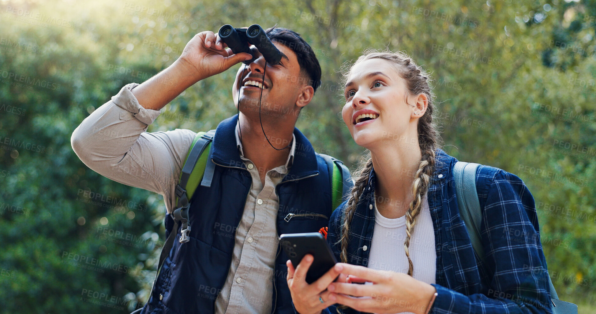 Buy stock photo Hiking, bird watching and couple with smartphone, binoculars and break with hobby, smile and network. People, outdoor and man with woman, adventure and cellphone with journey, traveling and friends