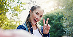 Hiking, woman and portrait with peace sign for selfie, adventure memory or excited outdoor by flare. Nature, female tourist or fitness with photography for travel holiday, trekking or profile picture
