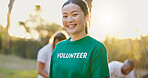 Portrait, volunteer and happy woman outdoor for community service or altruist at sunset. Clean, charity worker and person at park as philanthropy assistant, environment care or social responsibility