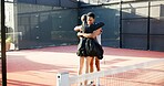 Happy people, hug and tennis with love for game, match or friendly sportsmanship on court or turf. Man, woman or friends with embrace for fitness, workout or outdoor bonding together on sports ground