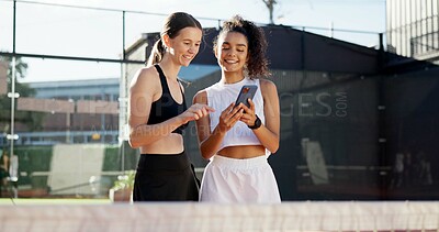 Buy stock photo Sports, online and women with phone on tennis court for social media post, internet joke or chat. Fitness club, happy and friends on smartphone after training, exercise and workout for match practice