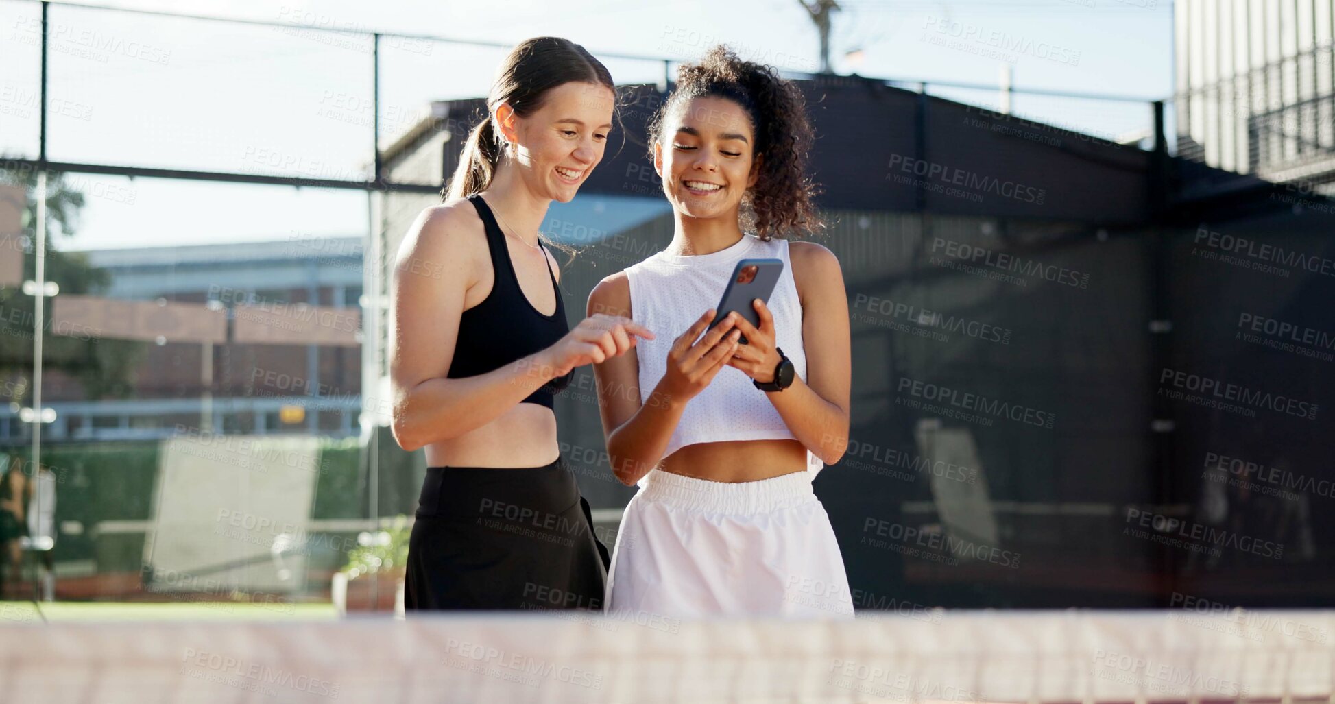 Buy stock photo Sports, online and women with phone on tennis court for social media post, internet joke or chat. Fitness club, happy and friends on smartphone after training, exercise and workout for match practice