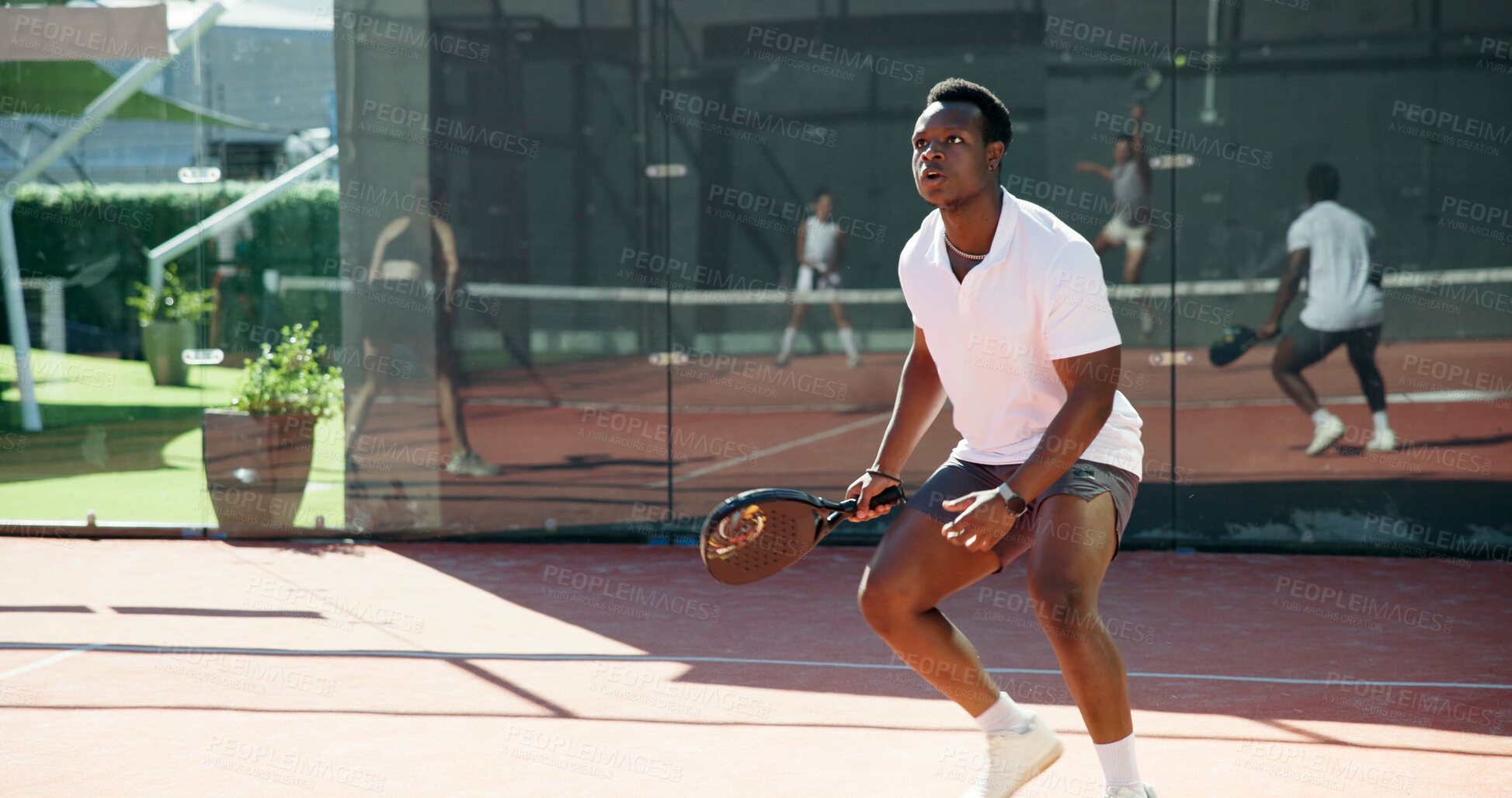 Buy stock photo Tennis sport, man and racket on court for playing tournament, competition event and waiting for ball. Ready, padel player and athlete for challenge training, performance fitness and workout practice
