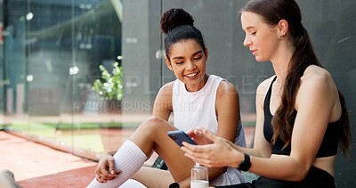 Buy stock photo Sports, tennis court and women with phone rest for social media post, internet joke and chat. Fitness club, happy and friends on smartphone after training, exercise and workout for match practice