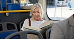 Reading book, travel and bus with senior woman, journey and hobby with break. Mature person, public transportation and pensioner with novel, literature and passenger with creativity and relax