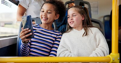 Buy stock photo Children, friends and travel on transport with selfie for happy memory, school trip and education adventure. Girls, students and smile with photography on bus for morning commute or social media post