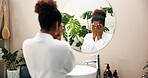 Woman, face and wash with mirror for hygiene, skincare or morning routine in bathroom at home. Female person, dermatology or facial treatment with reflection for collagen or anti aging cosmetics