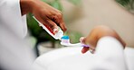 Oral hygiene, hands and toothpaste on toothbrush in home for brushing teeth, fresh breath and plaque removal. Morning routine, person and getting ready in bathroom with dental care and mouth cleaning