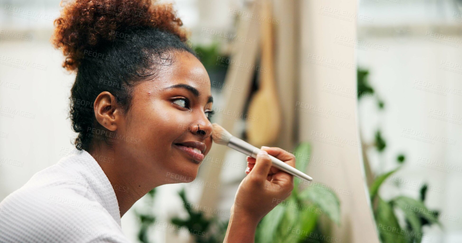 Buy stock photo Happy woman, mirror and beauty with makeup brush for cosmetics or morning in bathroom at home. Female person, face or applying foundation with smile or reflection for cosmetology or facial at house