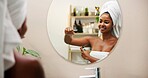 Body care, deodorant and woman with spray in mirror for odor control, fresh smell or getting ready in bathroom. Reflection, person or grooming routine in home for underarm hygiene and clean fragrance