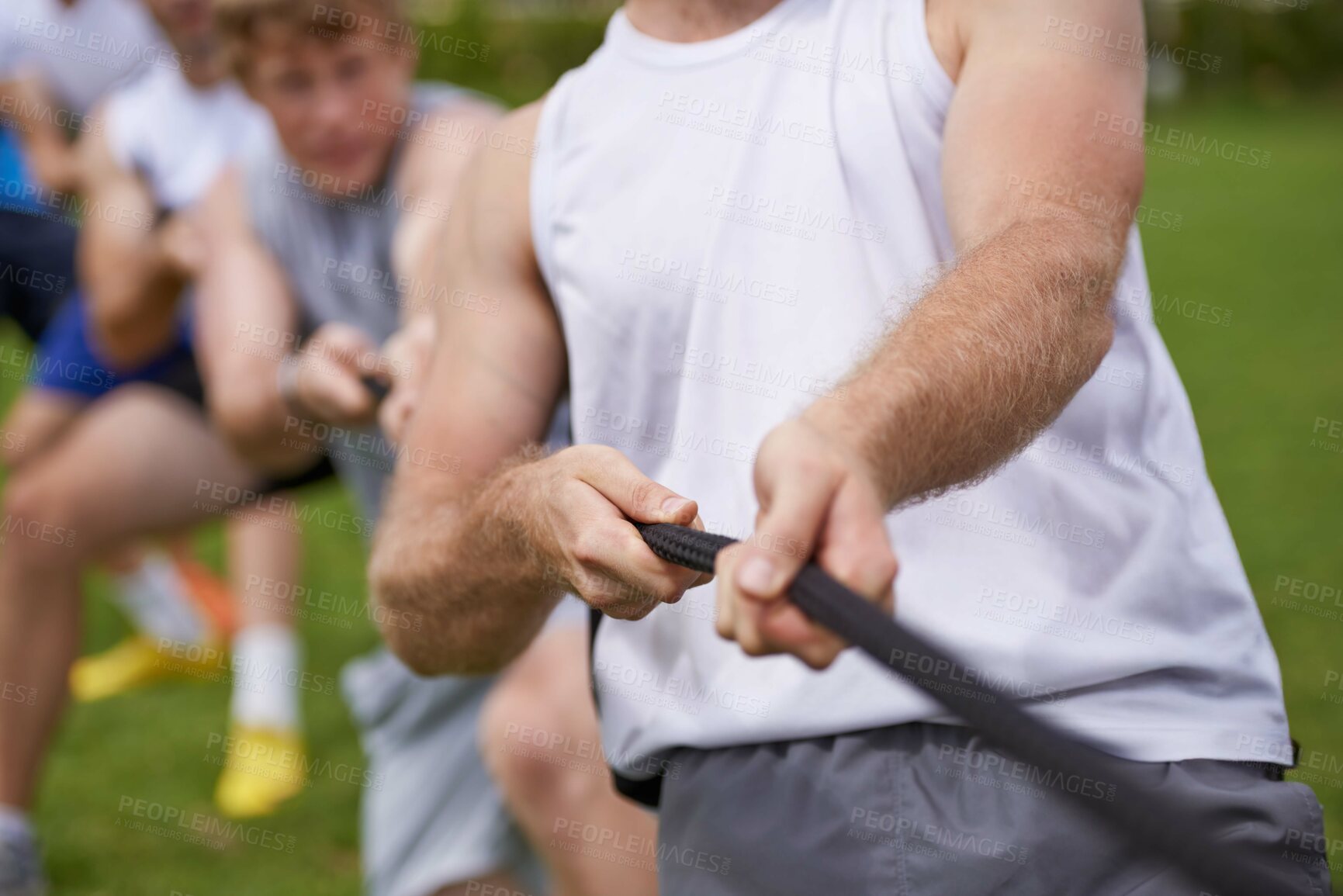 Buy stock photo Rope, arm pull and men hands with teamwork, tug of war and fitness outdoor on sport field. Training, workout and athlete group with support together for competition and strong exercise for health