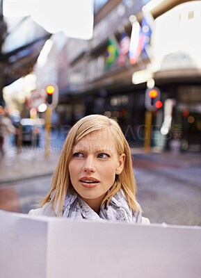 Buy stock photo Travel, map and confused with woman in city to search for directions to tourist location abroad. Thinking, stress and doubt with young person lost in overseas urban town for holiday or vacation