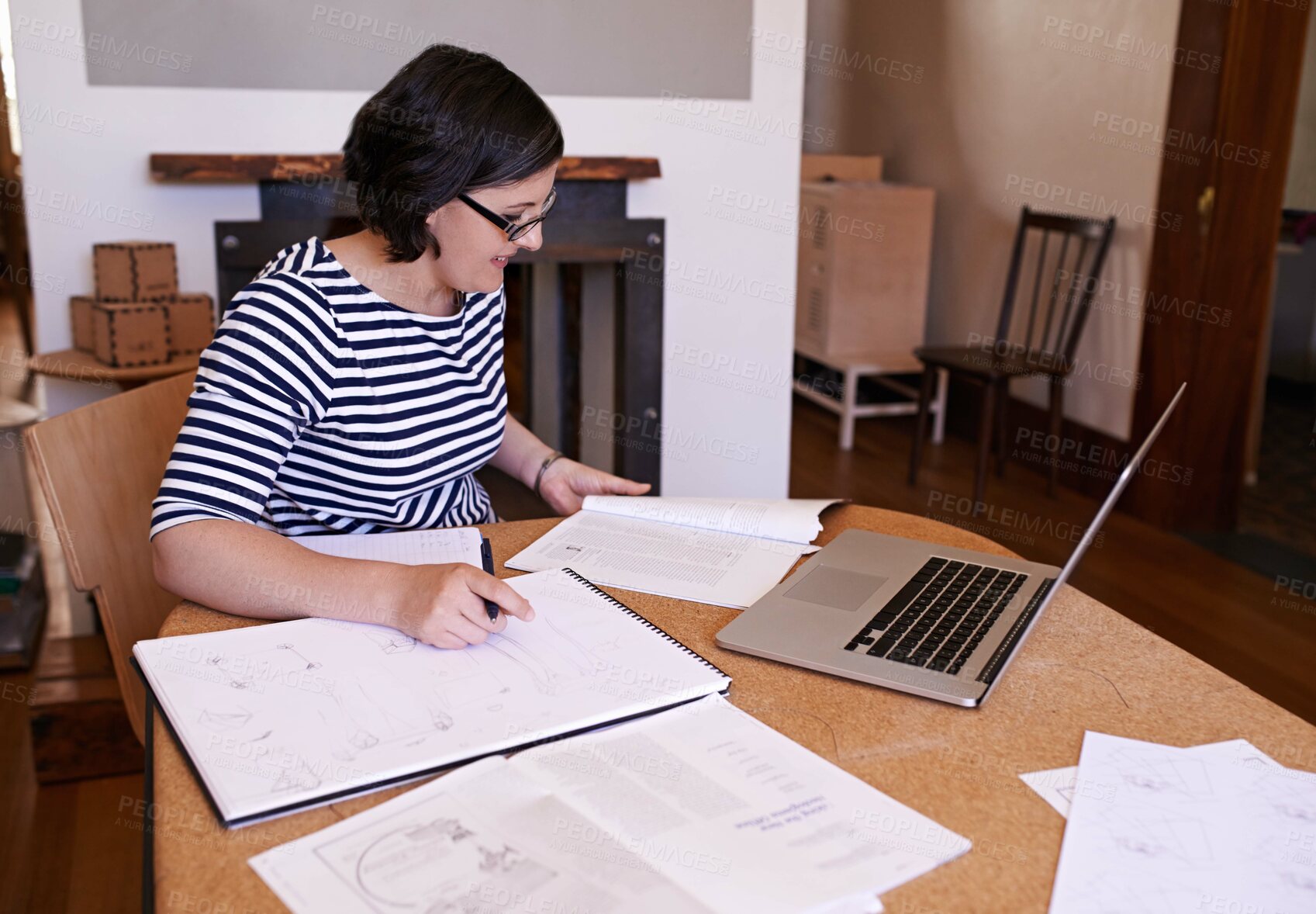 Buy stock photo Businesswoman, laptop and notes at desk, office and technology for working at home. Startup, drawings and computer for female designer in house, writing and notebook for business project planning