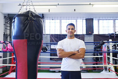 Buy stock photo Gym, portrait of boxer or man with pride for training, exercising and workout for competition. Professional, fighter or male athlete in ring with arms crossed, commitment and smile for sports