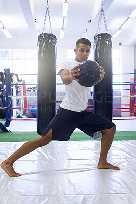 Buy stock photo Man, boxer and fitness with ball in gym for workout or training with motivation for health or wellness as fighter. Active, male person and exercise by boxing with power for strength or cardio for mma