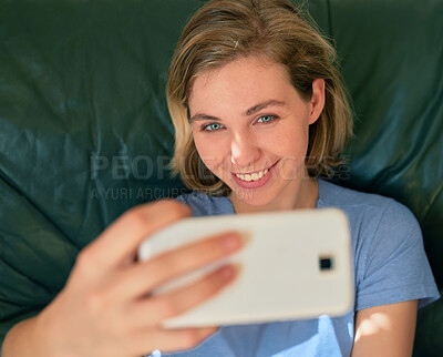 Buy stock photo Top view, happy woman and selfie on sofa in home for social media, memory and online post. Photography, smile and face of girl in profile picture above, relax or influencer on internet in living room