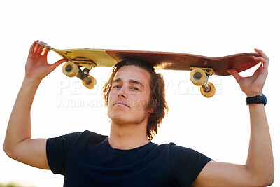 Buy stock photo Man, portrait and skateboard on head outdoor for hobby, skill practice and cruising. Male person, relax or rest in summer break ready for urban challenge, travel and extreme sports or freedom