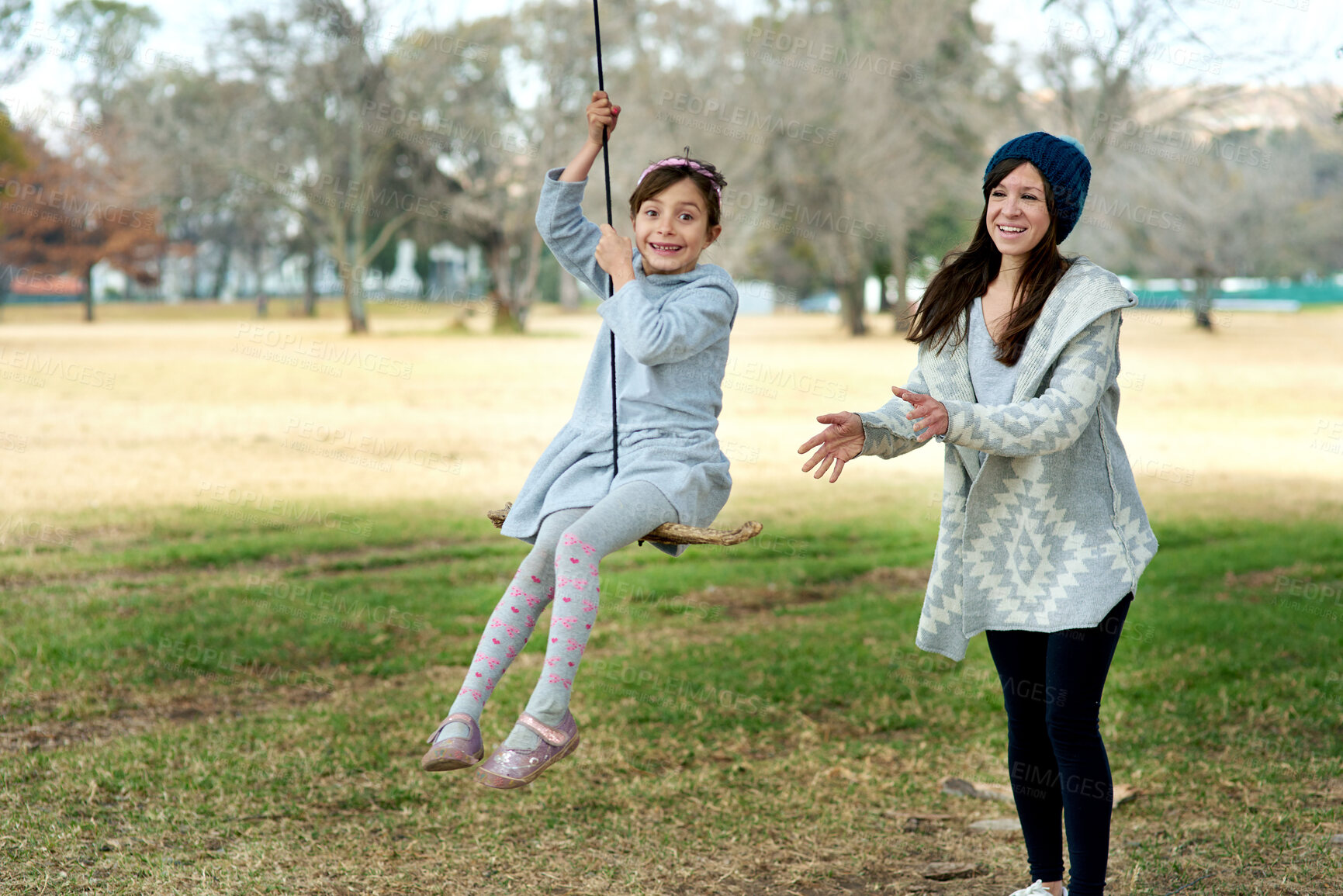 Buy stock photo Mother, portrait or child on swing in park on holiday or vacation in winter with freedom in games. Kid, playground or mom with happy girl, support or push for outdoor bonding together with fun moment