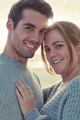 Buy stock photo Portrait, couple and hug with love on beach for romantic getaway on weekend for anniversary and embrace on vacation. Man, woman and bonding together for intimacy or care, affection and summer holiday