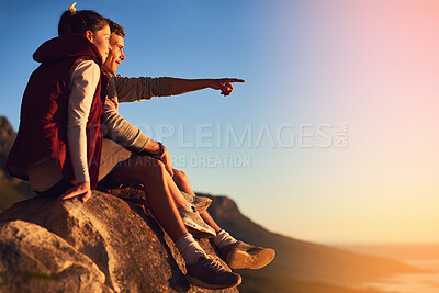 Buy stock photo Couple, mountain and outdoor with relax on cliff or point for view, adventure and bonding in nature or environment. Man, woman and together on rock for fresh air, peace and horizon with love on trip.