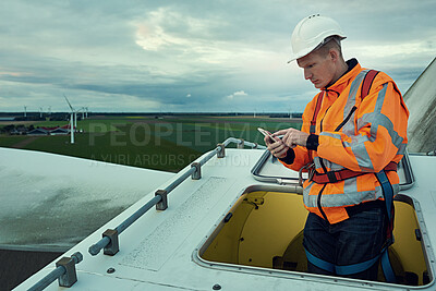 Buy stock photo Wind farm, inspection and man in electricity maintenance for outdoor industrial grid with checklist. Renewable energy, quality assurance and technician with paperwork at electrical windmill in field.