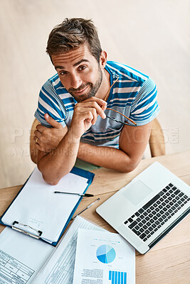 Buy stock photo Man, portrait and top view with laptop in home office for work as freelance web or graphic designer. Person, documents and data report for performance metrics, budget tracking and website progress.