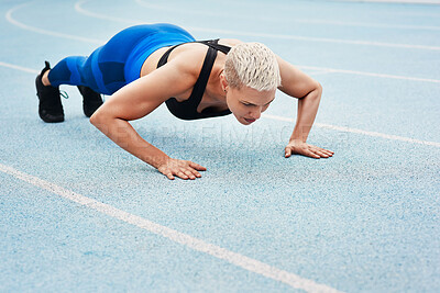 Buy stock photo Woman, pushups and track for sports, exercise and warm up in stadium or field for fitness. Female athlete, training and cardio in outdoor for wellness, performance and strong in body or strength