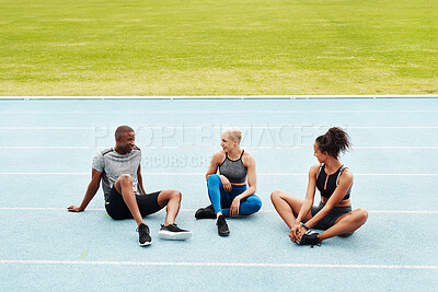 Buy stock photo Group, people and athlete or sitting on track for break, exercise or fitness for wellness. Man, women and diversity in stadium for training with pause, international and healthy with friends