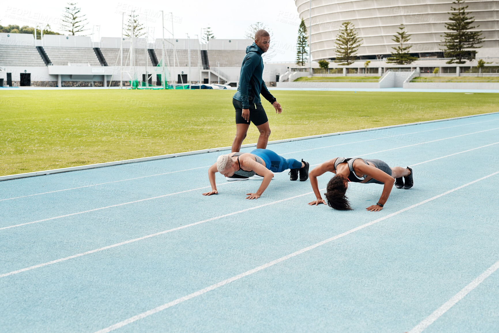 Buy stock photo People, push ups or runners on track for exercise, training or outdoor fitness workout with energy. Team, strong or athletes running in stadium with power or balance for practice, wellness or health