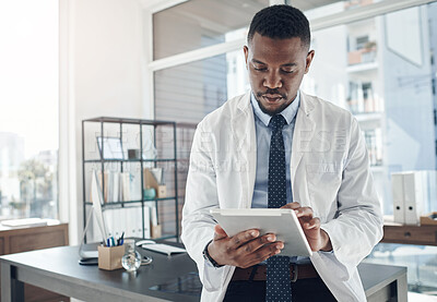 Buy stock photo Medical, doctor and tablet for work, office and telehealth for clinic, serious and online for healthcare. Workplace, hospital and internet and technology for black man, science and research of staff