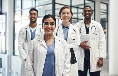 Buy stock photo Doctors, smile and portrait in hospital standing together for healthcare, wellness and solidarity. Clinic, surgeons or physicians in group for medical advice, teamwork or collaboration in medicine