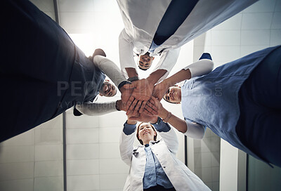 Buy stock photo Doctors, circle and below with hands in stack for diversity, support or solidarity in medical career at hospital. Men, women and team building for collaboration, portrait or happy for health services