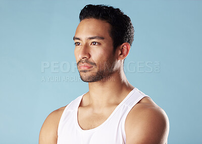 Buy stock photo Thinking, studio and fitness for man, serious and confident for muscle, break and body builder in gym. Blue background, healthy and person with sportswear for exercise, contemplating and wellness