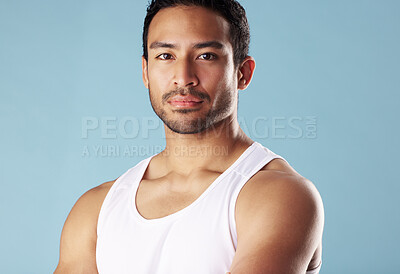 Buy stock photo Fitness, studio and portrait of man, healthy and serious for muscle, body builder and exercise in gym. Blue background, confident and person with sportswear for workout, strong or wellness in Mexico