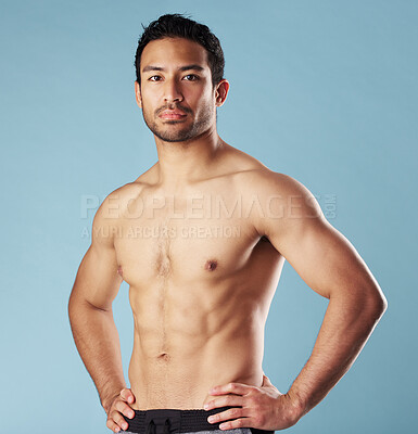 Buy stock photo Man, fitness and portrait with muscle in studio, pride and self care for body transformation by blue background. Asian person, bodybuilder and change with growth, strong and shirtless in Indonesia