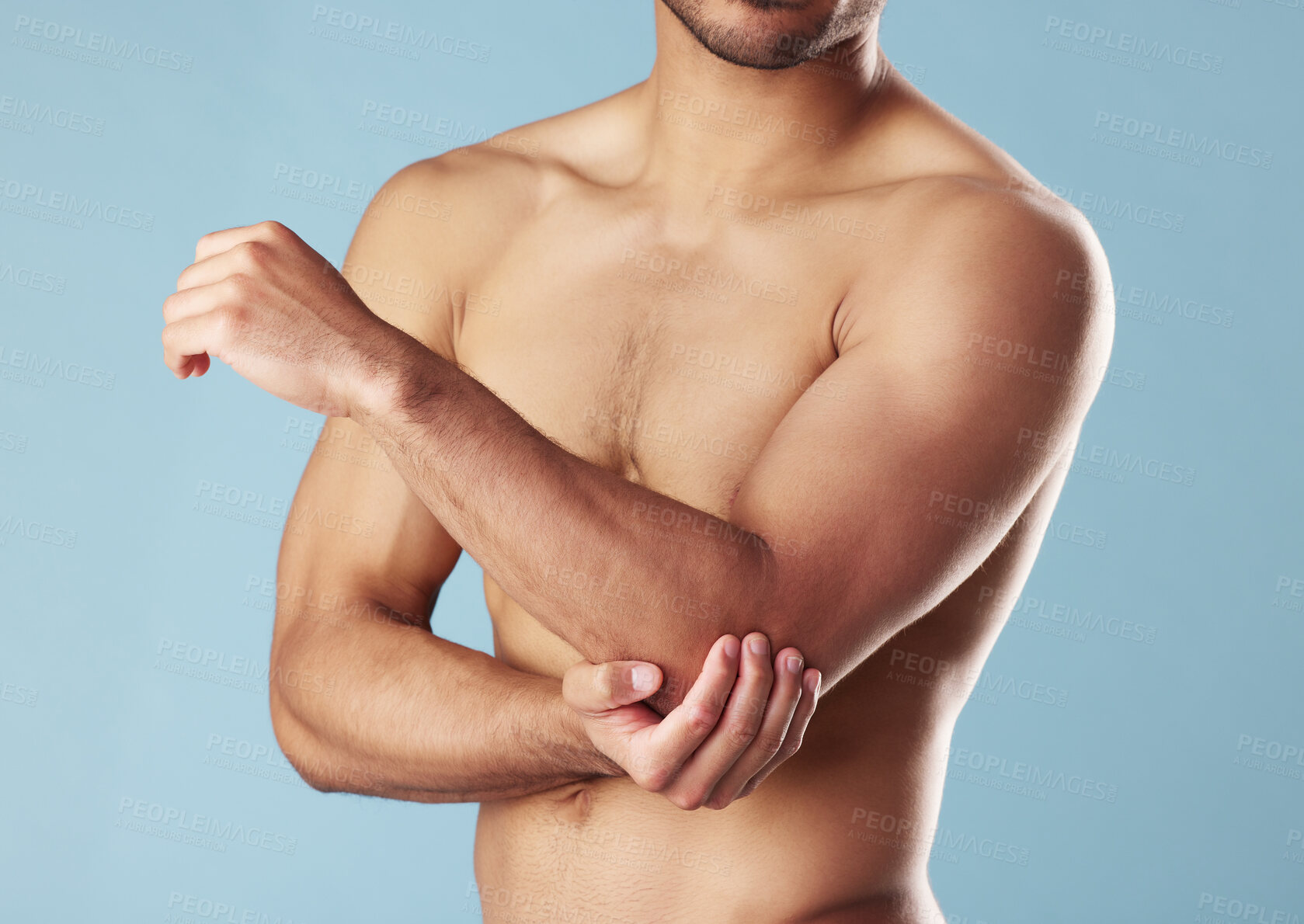 Buy stock photo Fitness, man and elbow injury in studio for joint problem, workout accident and discomfort. Athlete, topless or arm muscle tension with inflammation, fibromyalgia and exercise pain on blue background