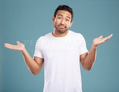 Buy stock photo Studio, man and portrait with shrugging for decision, uncertain and face expression for question. Hand gesture, male person and choice with scale for comparison, doubt and confused by blue background