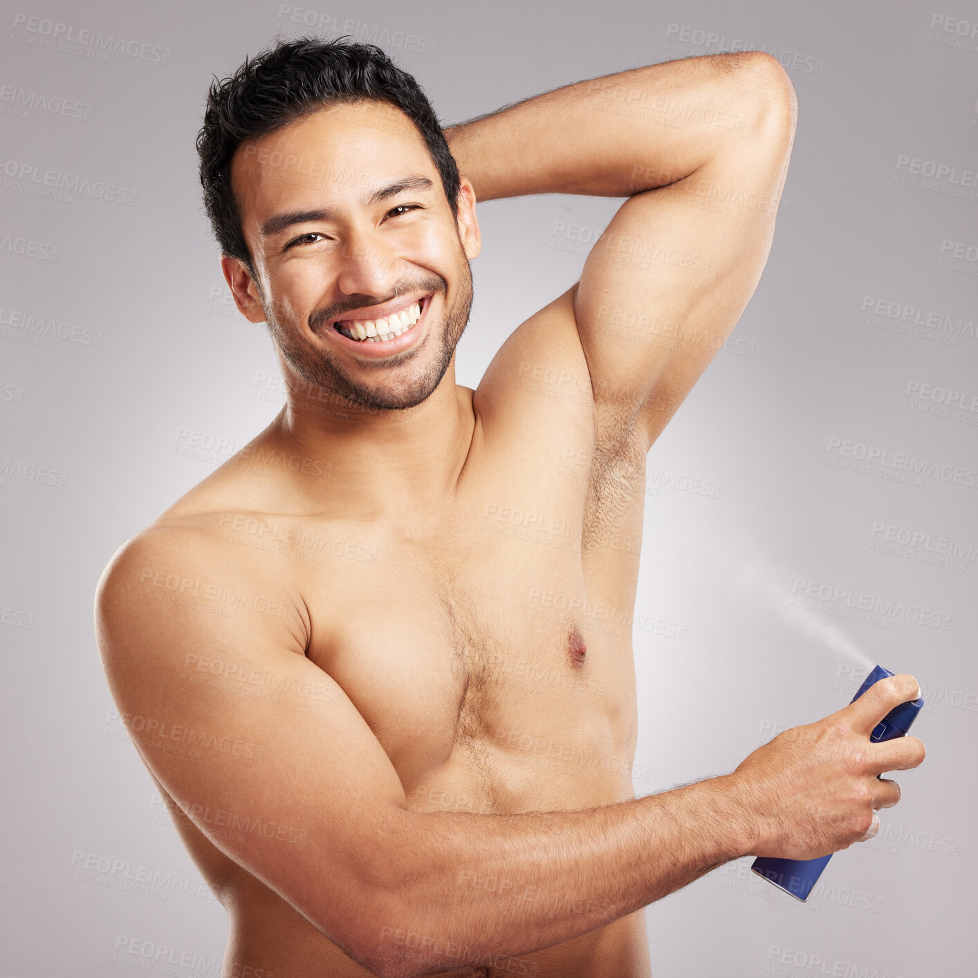 Buy stock photo Studio, man and portrait with spray for deodorant, hygiene and wellness with cosmetics for armpit. Smile, male person and model with skincare for sweat control, perfume product and gray background