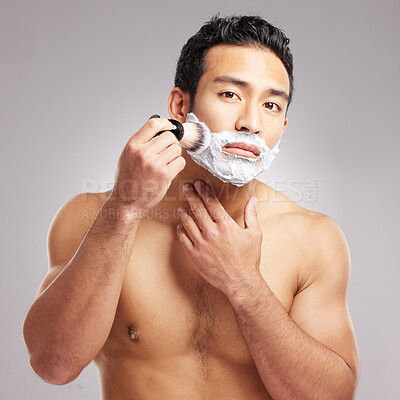 Buy stock photo Foam, beard and man with brush in studio for grooming routine, hair removal or face hygiene. Topless person, portrait or shaving cream application for depilation, skincare or space on gray background