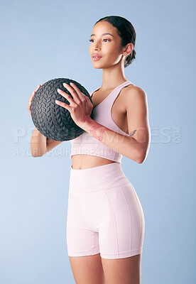 Buy stock photo Fitness, exercise or woman with medicine ball in studio for body workout, core stability or muscle strength. Athlete, girl or equipment for training, health performance or wellness on blue background