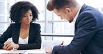 Businessman, writing or legal agreement with documents for contract, signature or business deal at office. Employee, colleagues or coworkers with paperwork for corporate assets, partnership or policy