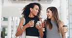 Businesswomen, coffee and friends walking with phone in office for conversation. Happy workers, lobby and team with drink, collaboration and listening to gossip in creative startup on break together