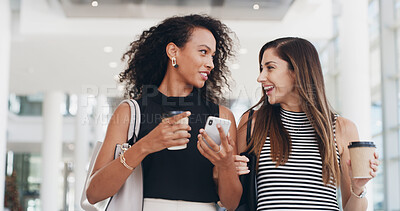 Buy stock photo Businesswomen, coffee and friends walking with phone in office for conversation. Happy workers, lobby and team with drink, collaboration and listening to gossip in creative startup on break together