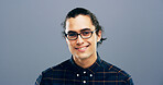Happy man, portrait and designer with glasses in studio of creative geek for web or app design on a gray background. Face, male person or nerdy model with smile, clothing or outfit on mockup space