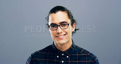 Buy stock photo Happy man, portrait and designer with glasses in studio of creative geek for web or app design on a gray background. Face, male person or nerdy model with smile, clothing or outfit on mockup space
