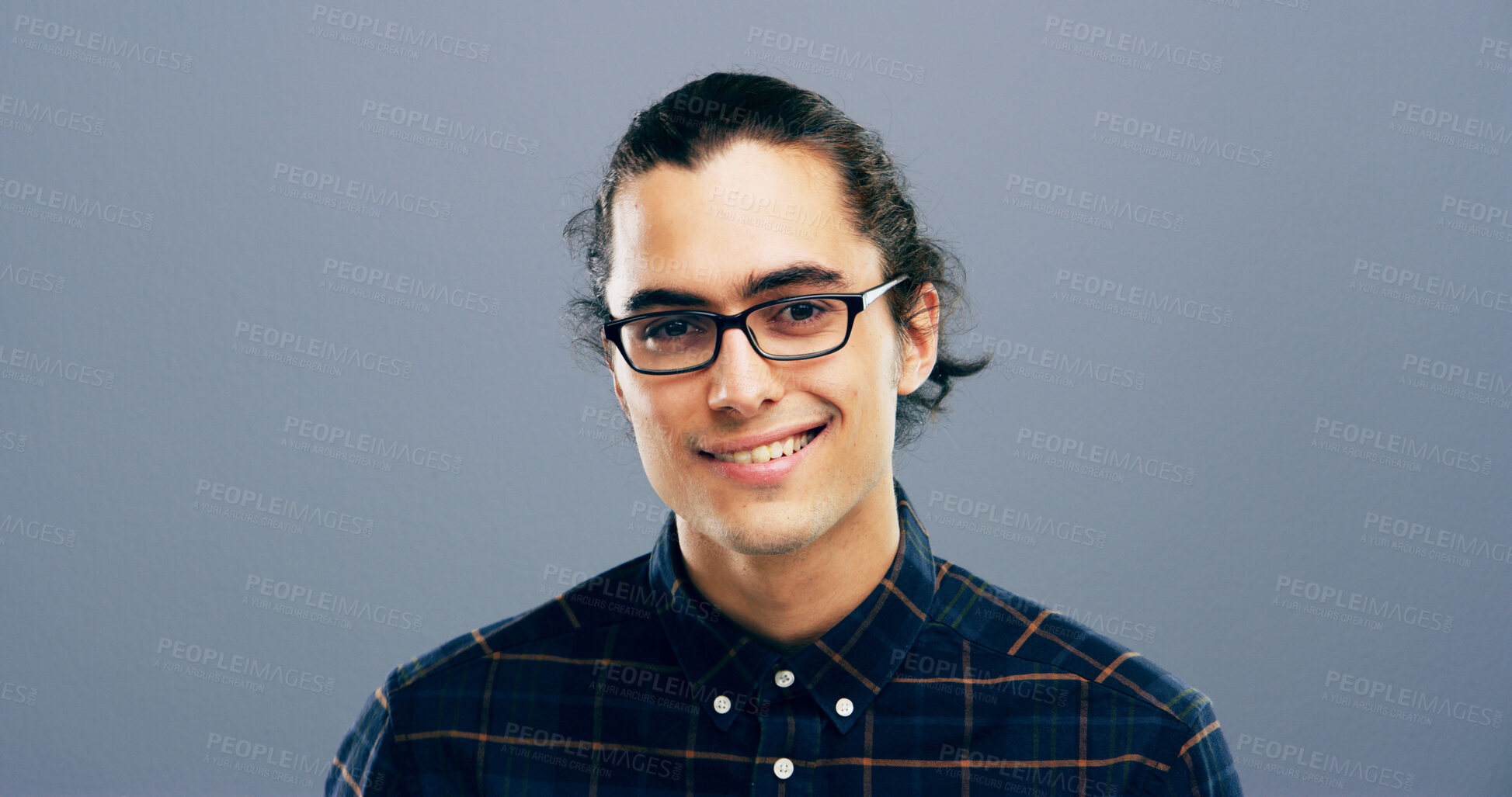 Buy stock photo Happy man, portrait and designer with glasses in studio of creative geek for web or app design on a gray background. Face, male person or nerdy model with smile, clothing or outfit on mockup space