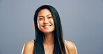 Asian, happy woman and portrait with hair style or positive attitude for creative ambition on a gray studio background. Face, female person or gen z model with smile or confidence for natural beauty