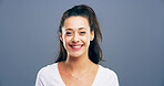 Happy woman, portrait and style with expression or positive attitude for fashion or hair on a gray studio background. Face, female person or model with smile for clothing or outfit on mockup space
