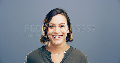 Buy stock photo Happy woman, portrait or expression with positive attitude for casual style or confidence on a gray studio background. Face, female person or model with smile for behaviour or emotion on mockup space